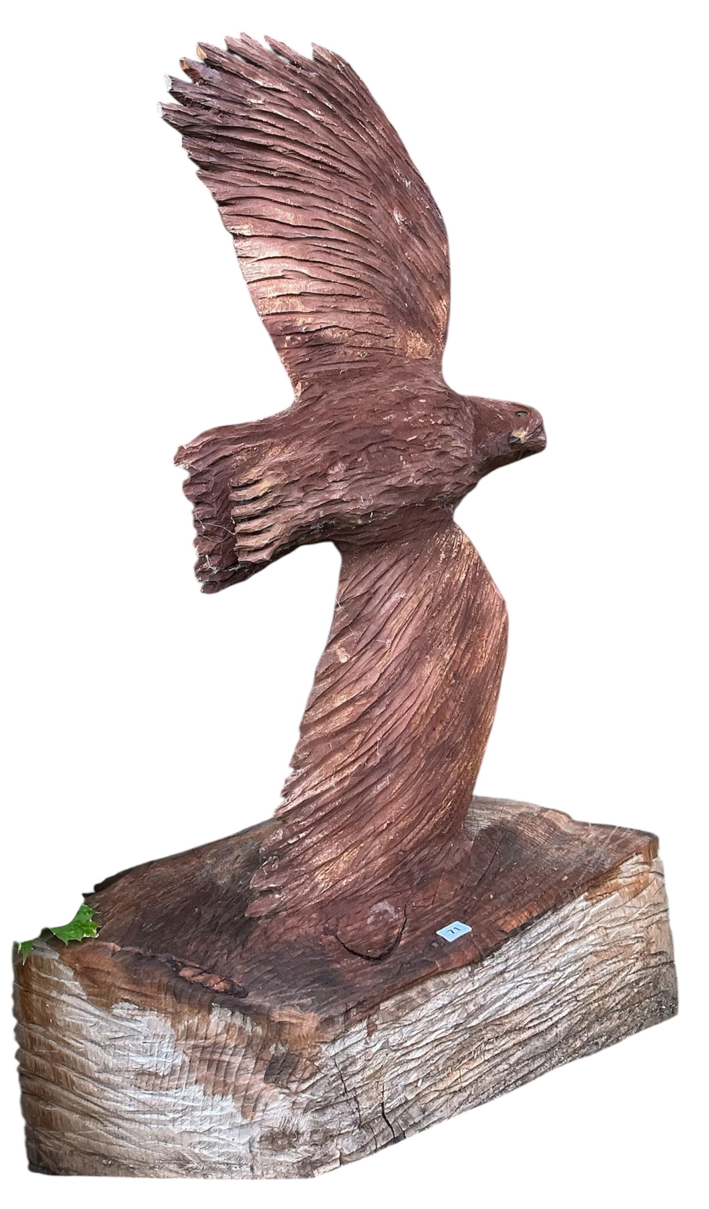 A chainsaw carving of an eagle in flight, height 170cm